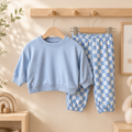 🩵 Set 2 piezas niño/niña – Sudadera azul + Pantalón cuadros